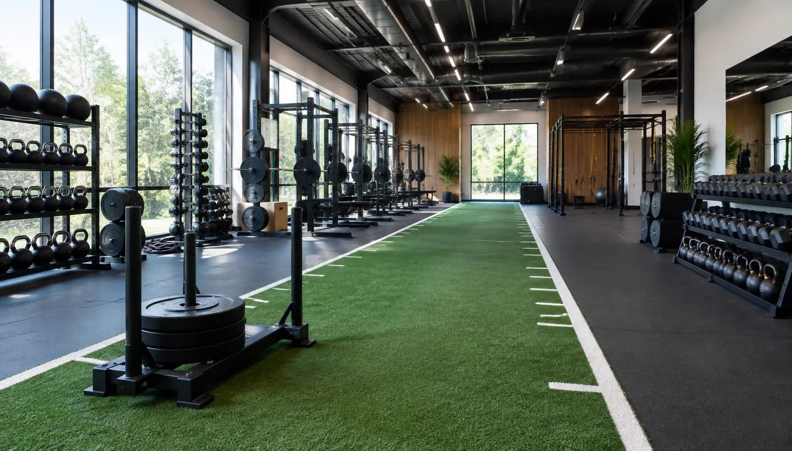 Carpet-style turf sled lane in an Austin training gym
